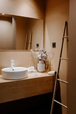 a bathroom with a sink and a mirror at Laurear Guest House in Porto