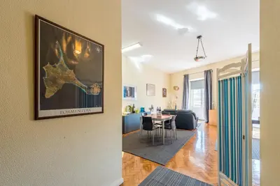 a view of a living room and a dining room at GuestReady - Minimalistic studio downtown in Porto