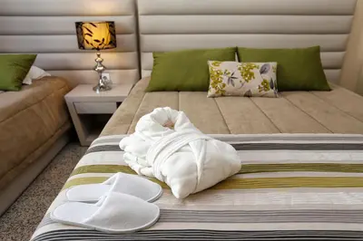 a hotel room with a bed with towels on it at Oporto City Centre Apartments in Porto
