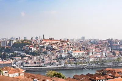 a view of a city with a river and buildings at GuestReady - Porto Magic View in Vila Nova de Gaia