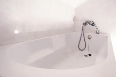 a white bathroom with a toilet and a window at 57 in Porto