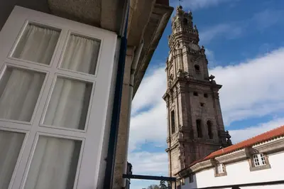 a building with a window and a clock tower at Oporto Centre Clean & Cozy Apt 2 in Porto