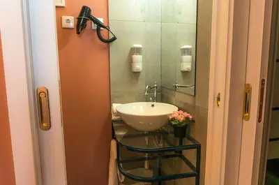 a bathroom with a sink and a mirror at Oporto Center Clean & Cozy Apt 3 in Porto
