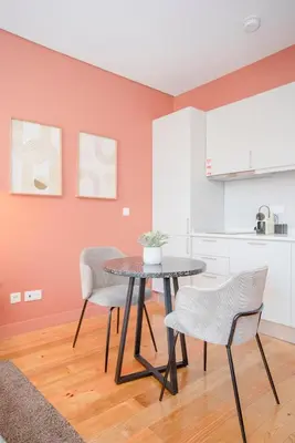 a dining room with a table and chairs in a kitchen at Liiiving in Porto - Historic Clérigos Apartments in Porto