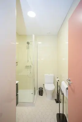 a bathroom with a toilet and a shower at Liiiving in Porto - Historic Clérigos Apartments in Porto