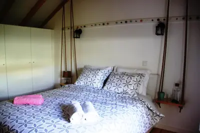 a bedroom with a bed with towels on it at Loft Mártires in Porto