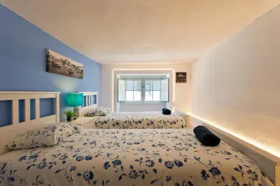 a bedroom with two beds and a window at Oporto Blue Picaria - Unique Citycenter Apartment in Porto