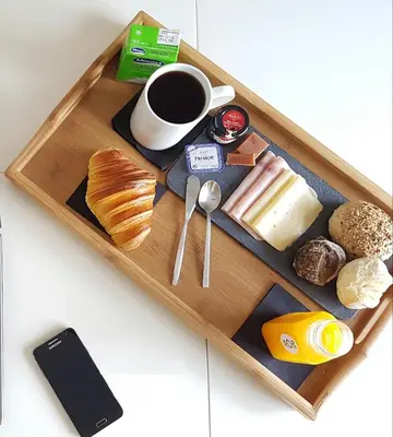 a tray with breakfast foods and a cup of coffee at Porto Views & Wines by Porto City Hosts in Vila Nova de Gaia