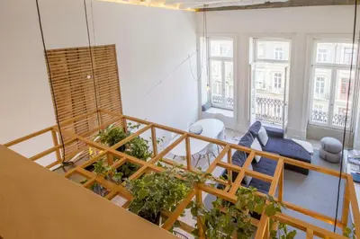 an apartment with stairs and plants in a room at OHH - Mouzinho Deluxe Apartment in Porto