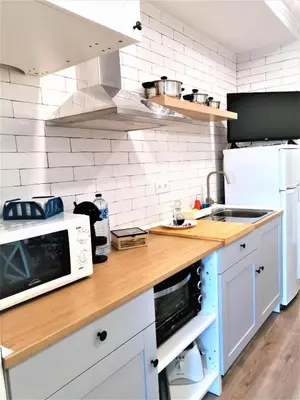 a kitchen with a counter top with a microwave at Porto Ville Touring in Porto
