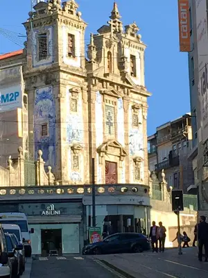 an old building with a car parked in front of it at Invictus Place in Porto