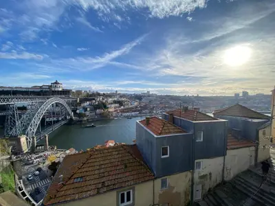 a view of a city with a bridge and a river at Casa Dona Olga River View in Porto
