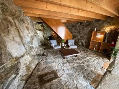 an overhead view of a room with a stone wall at Casa Dona Olga River View in Porto