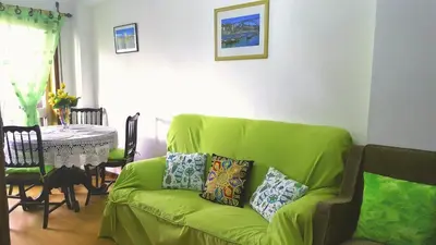 a dining room with a table and a couch at Apartment Rustic Oporto in Porto