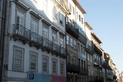 a white building with balconies on the side of it at Merc Porto Ribeira's Up place in Porto