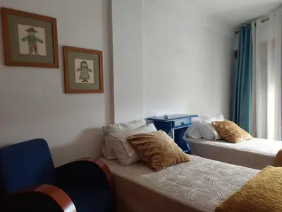 a room with two beds with pillows on them at Apartamento Porto Centro in Porto