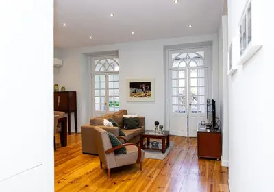 a living room with a couch and a table at Bonjardim Terrace in Porto