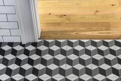 a bathroom with a black and white checkered floor at BmyGuest - Porto Design Central Apartment in Porto