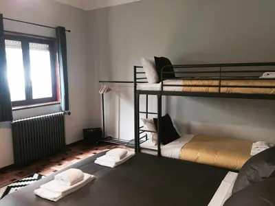 a room with two bunk beds and a window at AC House in Porto