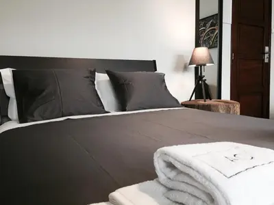 a bedroom with a bed with a white towel on it at AC House in Porto
