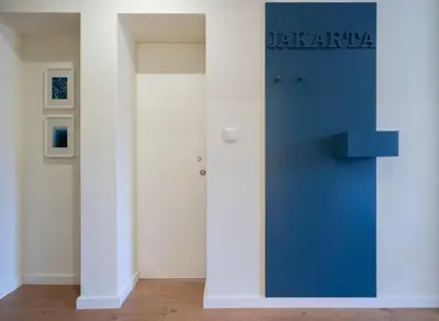 a pink door with the word fusilia on it in a bathroom at Domus 21 - Entreparedes in Porto