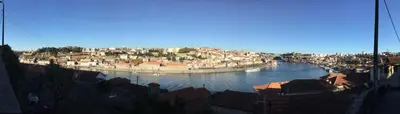 a view of a river with buildings and a city at My Portugal for All - Oporto Flat in Vila Nova de Gaia