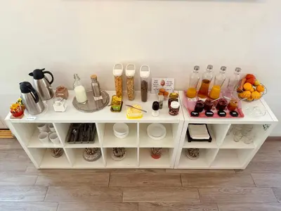 a white shelf with food and drinks on it at Firmeza 358 studios - street level in Porto