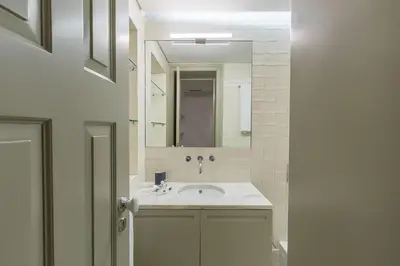 a bathroom with a sink and a mirror at Casa Amarela in Porto