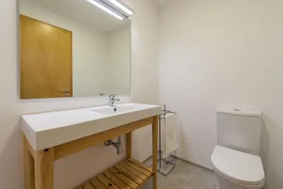a bathroom with a sink and a toilet at GuestReady - Warm cocoa retreat in Cedofeita in Porto