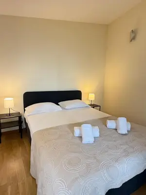 a bedroom with a large bed with two white pillows at Peter Residence - Rio Douro & Caves Vinho do Porto in Vila Nova de Gaia