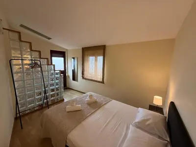 a bedroom with a bed with two towels on it at Peter Residence - Rio Douro & Caves Vinho do Porto in Vila Nova de Gaia