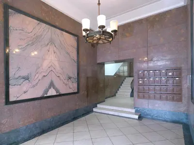 a hallway with a large painting on the wall at FLH Porto Central Apartment in Porto