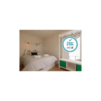 a bedroom with a bed and a window with the words eat pray love at Secret Camões in Porto