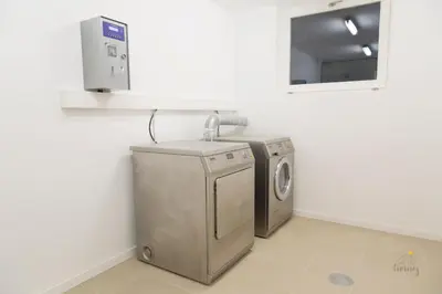 a laundry room with a washing machine and a mirror at Oporto Ceuta Residences - Residence 8 by We Do Living in Porto