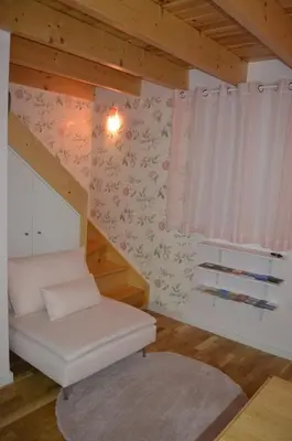 a living room with a white couch and a window at Rose Green Loft in Porto