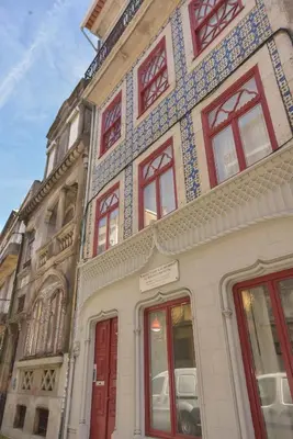 a building with red and blue tiles on it at Rose Green Loft in Porto