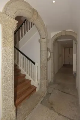 an archway leading up to a staircase in a house at Rose Green Loft in Porto