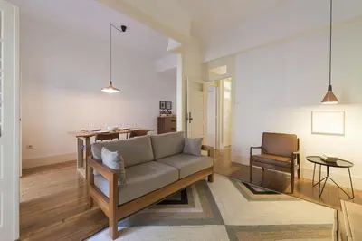 a living room with a couch and a table at Tripas-Coração, Breiner GreenHouse in Porto