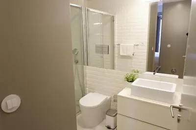 a bathroom with a toilet and a sink and a shower at Porto Urban Art Trindade in Porto