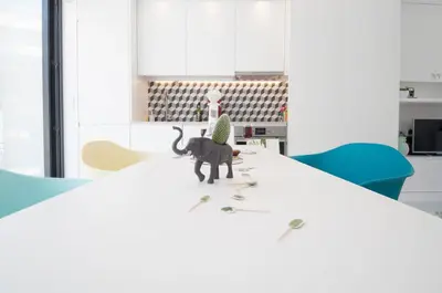 a figurine of a cat sitting on a table at Porto Moments Apartments by Portugal Collection in Vila Nova de Gaia