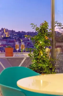 a room with a table and a window with drinks at Porto Moments Apartments by Portugal Collection in Vila Nova de Gaia