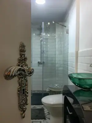 a bathroom with a shower and a toilet and a sink at Oporto Batalha Residence free parking in Porto