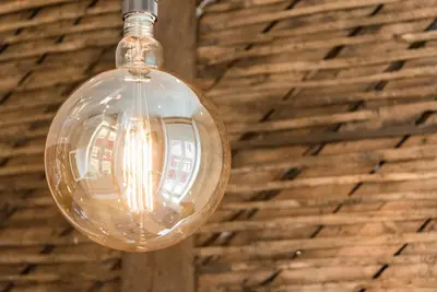 a glass light bulb hanging from a wall at GuestReady - Chic retreat in the heart of Porto in Porto