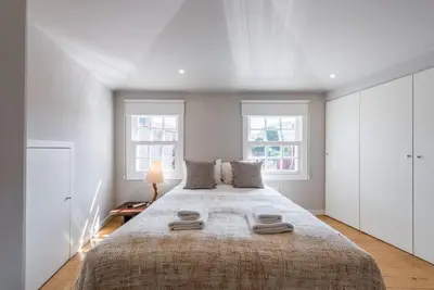 a bedroom with a large bed with two towels on it at GuestReady - Chic retreat in the heart of Porto in Porto
