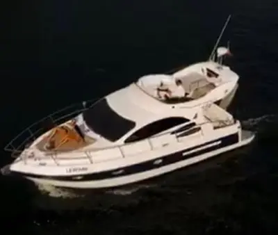 a white boat floating in the water at Porto Private Yacht- Accommodation Douro River in Porto
