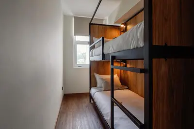 a bedroom with two bunk beds and a window at Cosme Apartments by Olala Homes in Porto