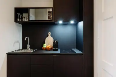 a kitchen with a counter top with a sink and a counter top at Cosme Apartments by Olala Homes in Porto