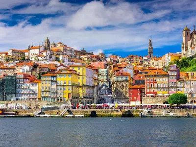 a view of a city from the water at Oporto up Town in Porto