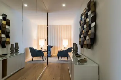 a living room with a table and chairs in a room at Oporto up Town in Porto