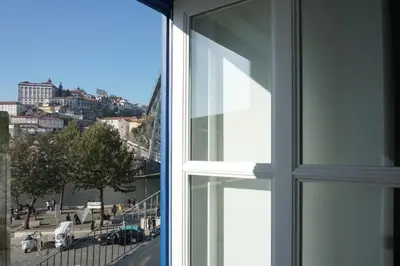 an open window with a view of a city at Porto View by Patio 25 in Vila Nova de Gaia